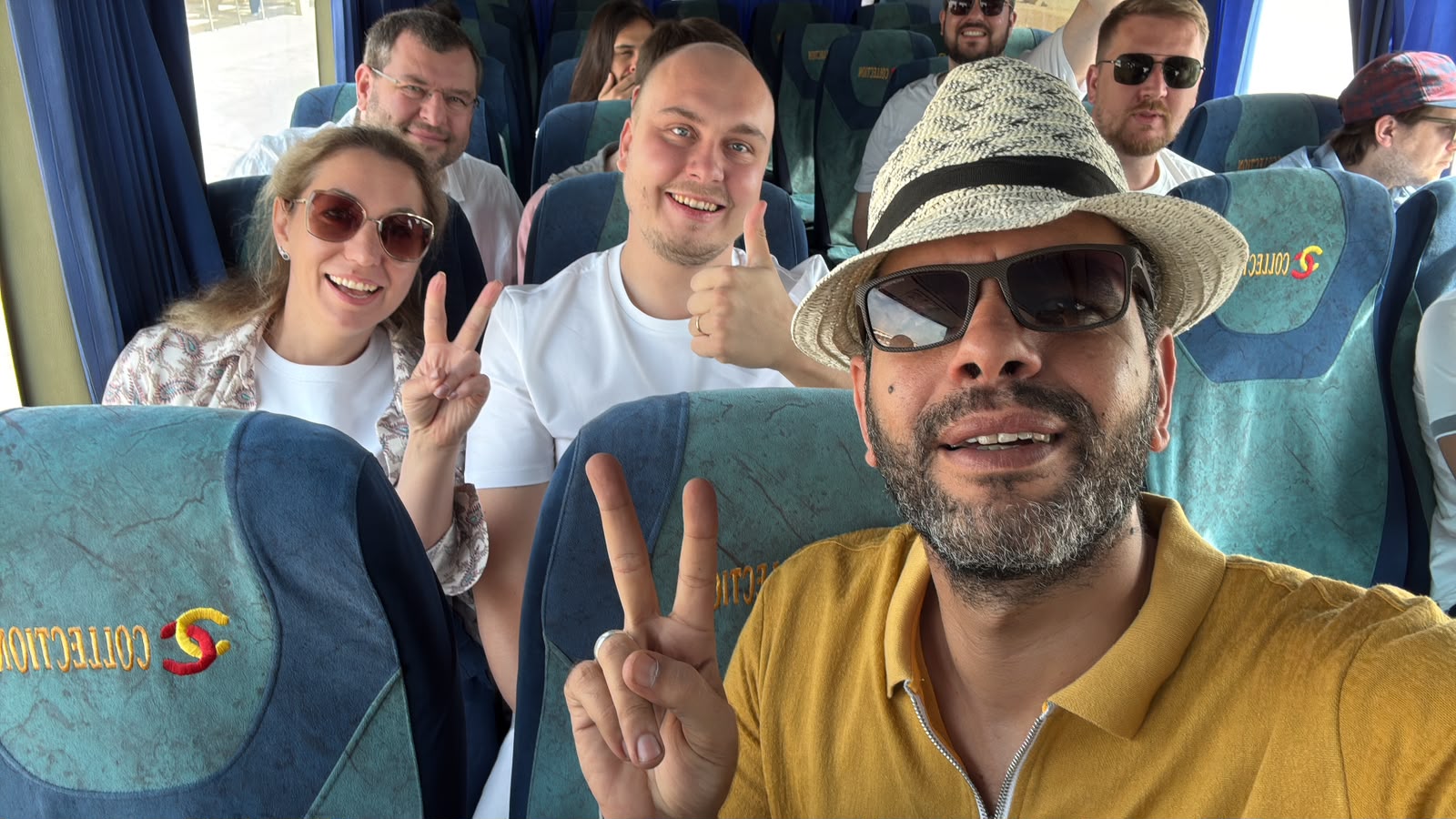 Happy Bashayer Travel group on a tour bus in Egypt