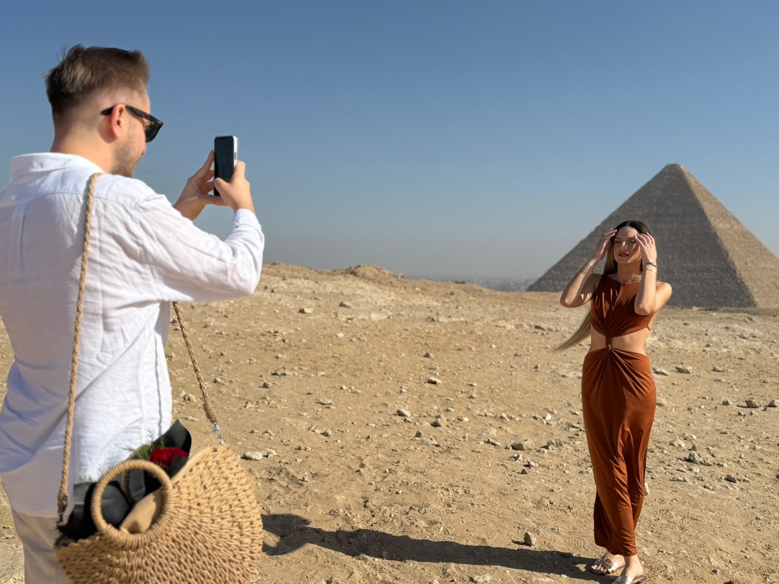 A traveler visiting the Giza Pyramids